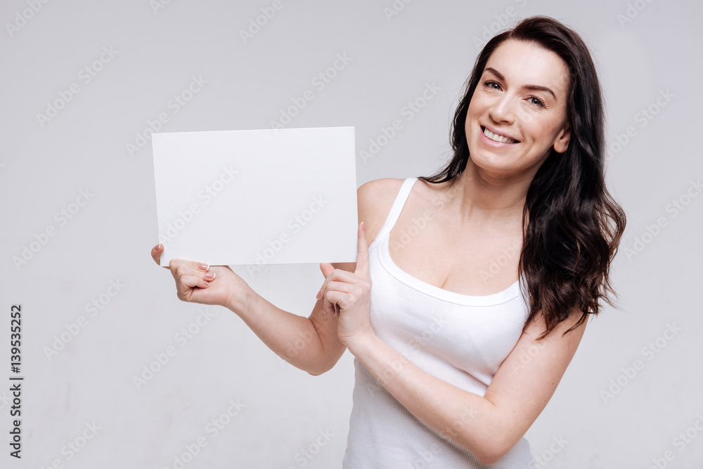 Radiant flawless girl demonstrating blank sign Radiant flawless girl demonstrating blank sign