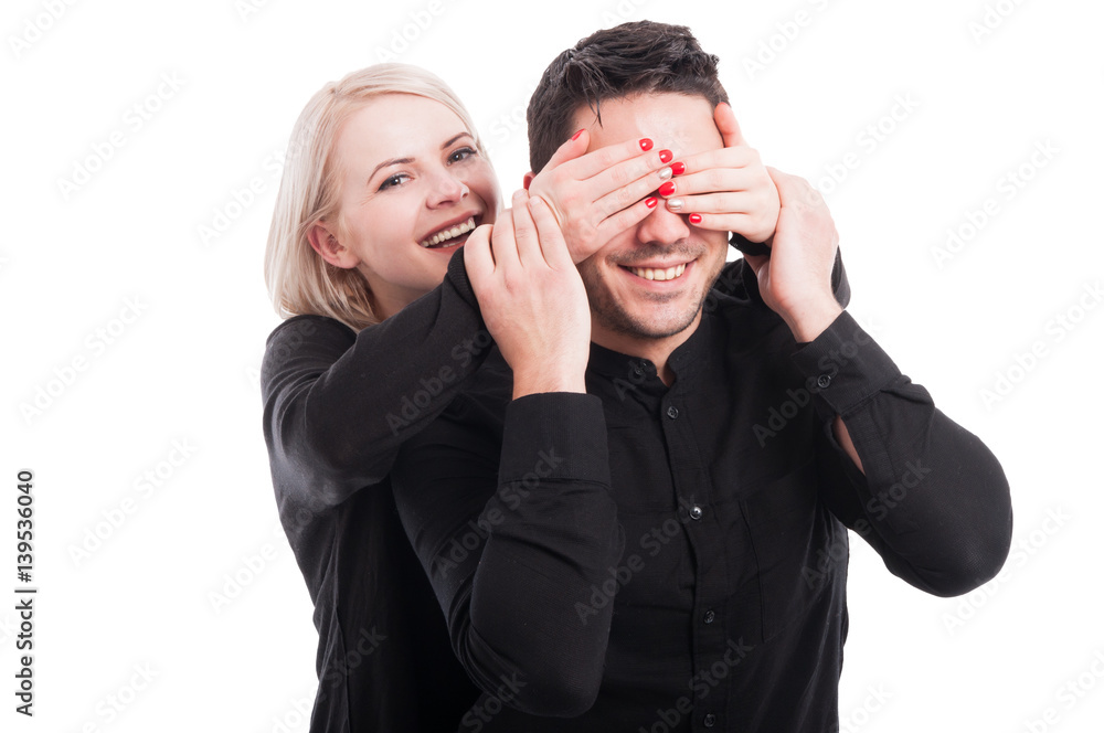 Happy young female surprising her boyfriend Happy young female surprising her boyfriend