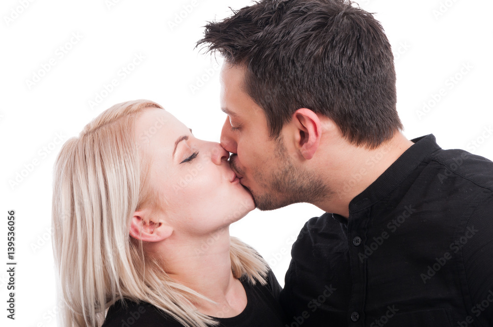 Close-up of pretty girl kissing handsome boy Close-up of pretty girl kissing handsome boy
