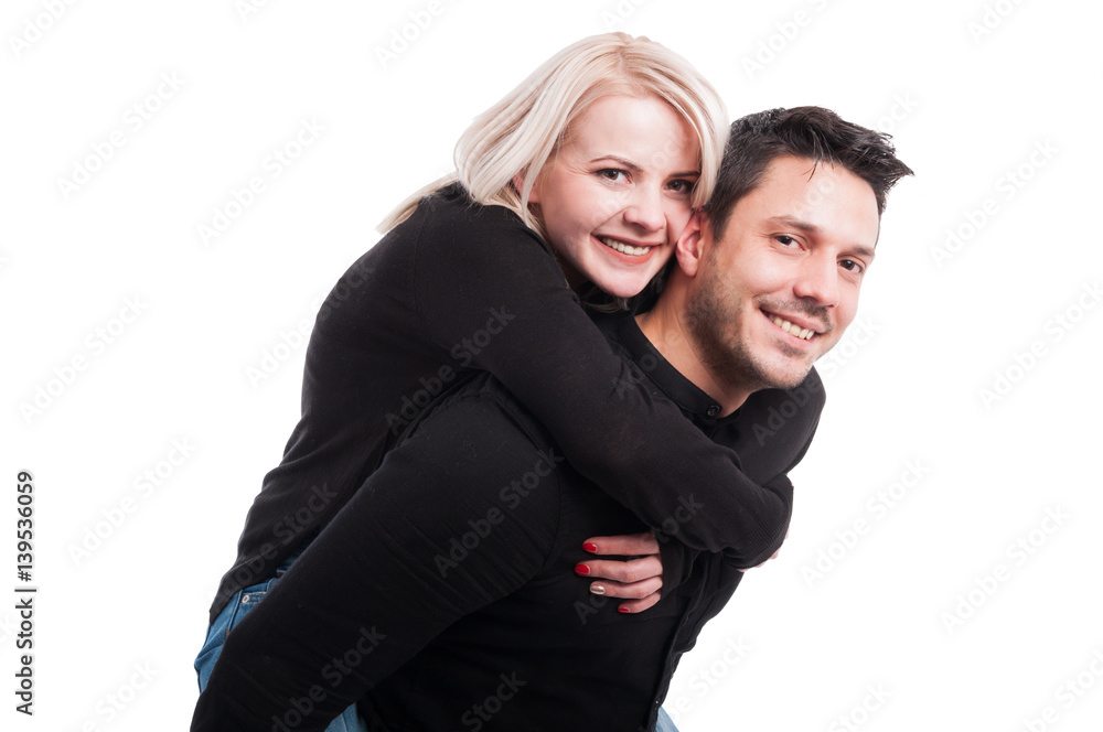 Happy portrait of man piggybacking his girlfriend Happy portrait of man piggybacking his girlfriend