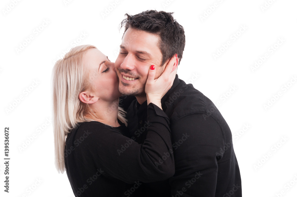 Happy loving female kissing her boyfriend Happy loving female kissing her boyfriend