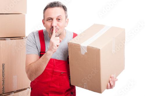 Mover man holding box and showing sush gesture photo