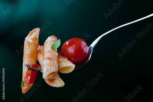 Pasta with cherry tomatoes, chili pepper and basil