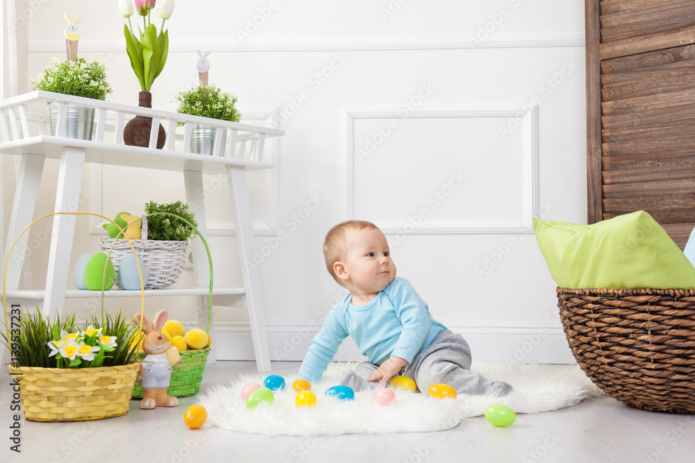 Easter egg hunt. Adorable child playing with Easter eggs at home Easter egg hunt. Adorable child playing with Easter eggs at home