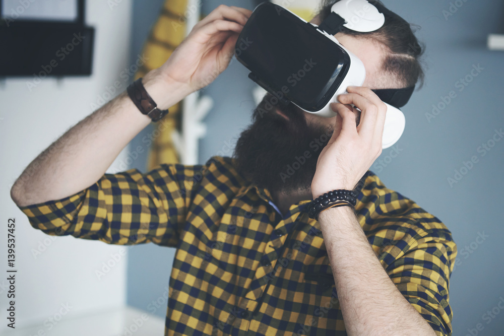 Bearded man using smart glasses