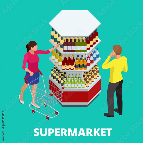 Women and men shopping alcohol in supermarket. Shelves with alcohol bottles. Choosing wine for dinner. Happy young couple choosing wine together while standing in wine store