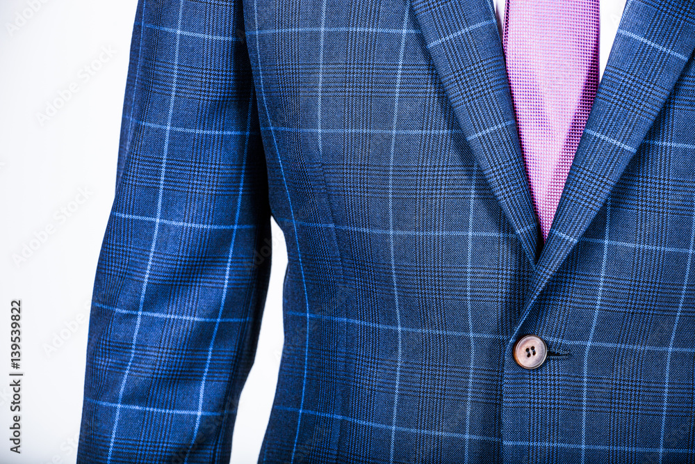 Detail of a blue suit jacket on a man Detail of a blue suit jacket on a man