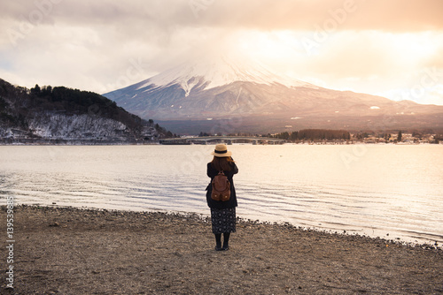 Tourist is watching Mt. Fuji at Lake Kawaguchiko in Japan.