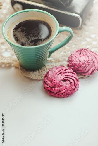 Sweet pink marshmallow - zephyr, cup of coffee on white background. Still Life.