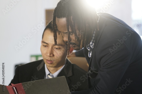 Asian and African American white collar workers in office