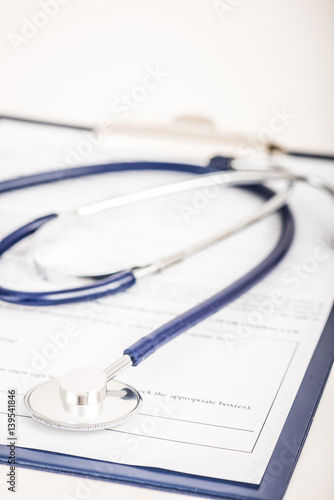 Medical examination report and stethoscope