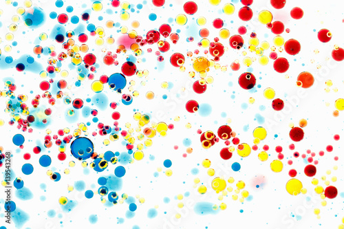 Abstract multicolor background. Bubbles of paint and ink on a white, pattern of drop.