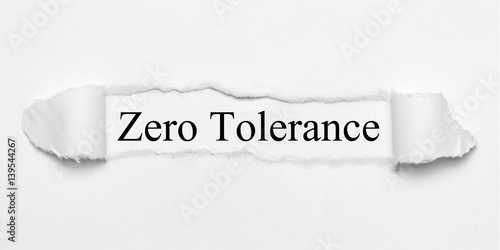 Foto Zero Tolerance on white torn paper