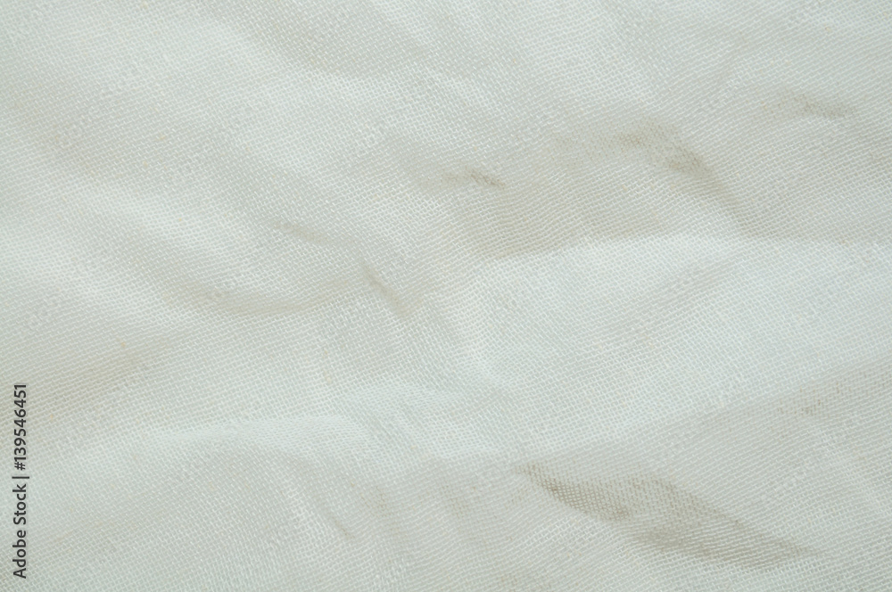 Closeup white color fabric texture. Fabric pattern design or crinkled upholstery abstract background.