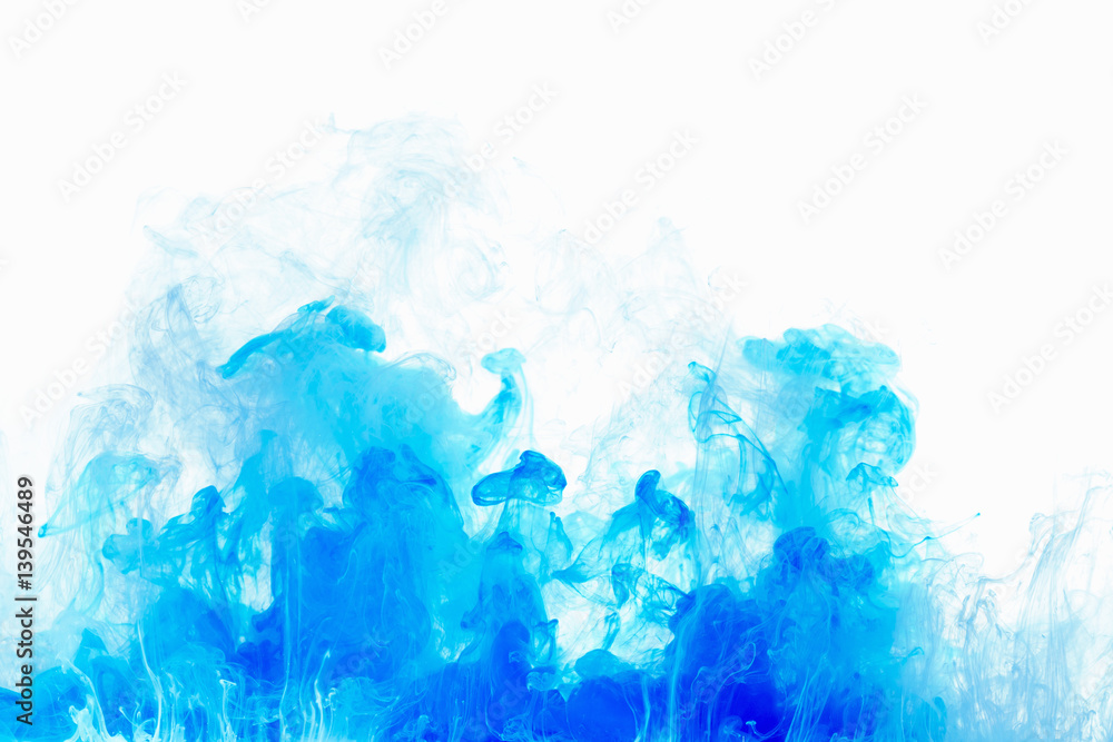 Abstract background color ink drop in water. Blue cloud of paint on white. Abstract background color ink drop in water. Blue cloud of paint on white.
