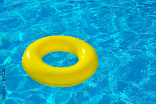 Inflatable tube floating in swimming pool