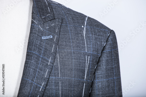 Details of a tailored suit jacket