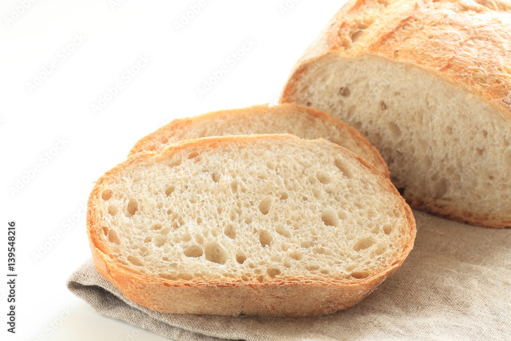 Sliced French bread on linen cloth Sliced French bread on linen cloth
