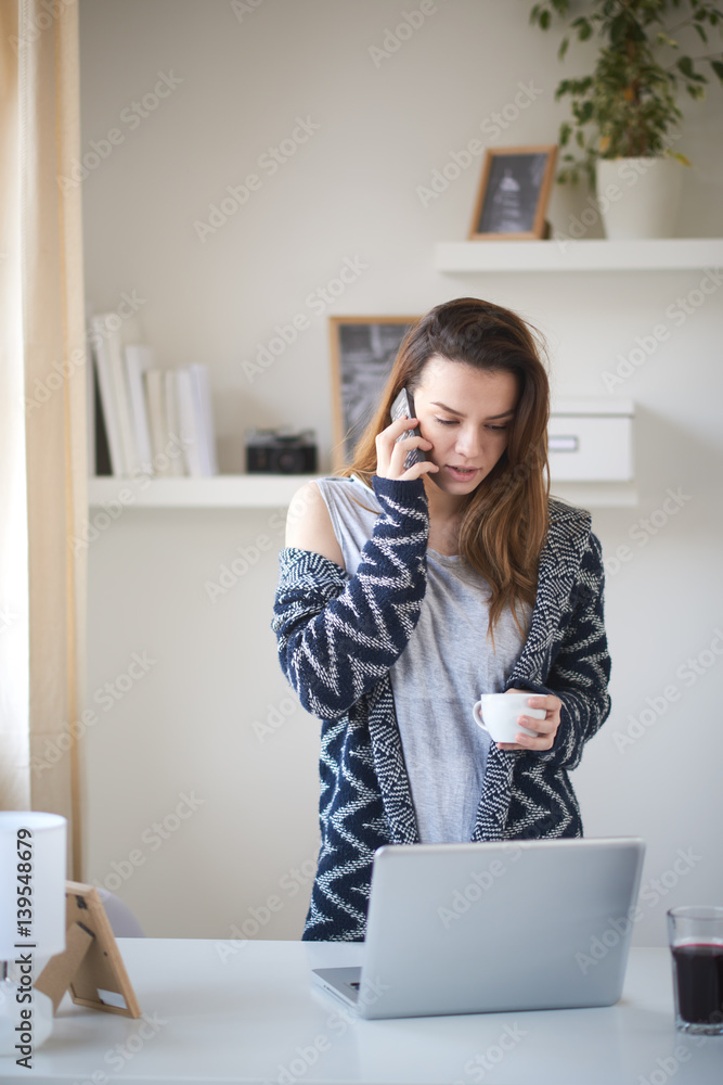 Young business girl in her personal workspace working Young business girl in her personal workspace working