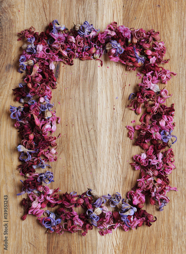 Frame of dried flowers on a wooden background. Vintage Frame of dried flowers on a wooden background. Vintage