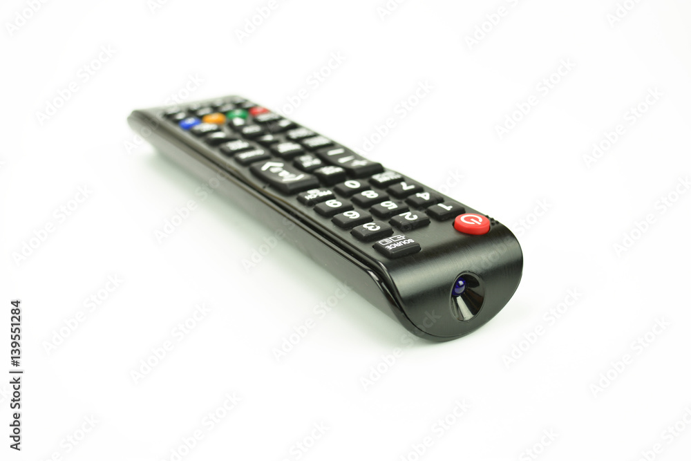 A black remote control on the white background A black remote control on the white background