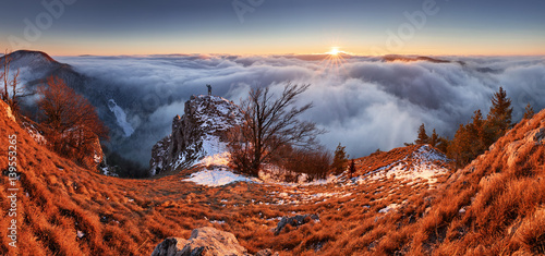 Above clouds in winter - mountain landcape at sunset, Slovakia