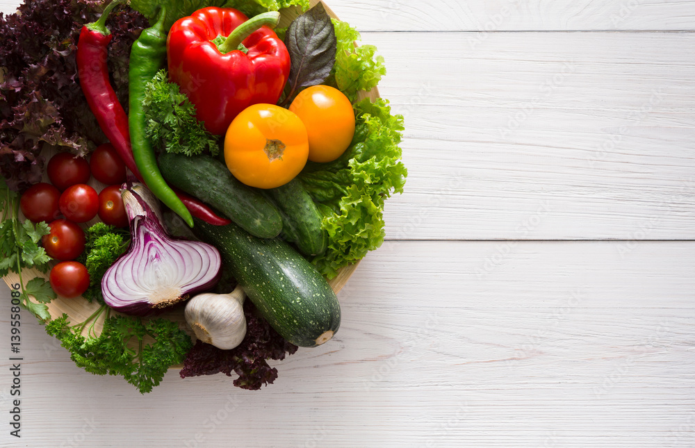 Border of fresh vegetables on wooden background with copy space Border of fresh vegetables on wooden background with copy space