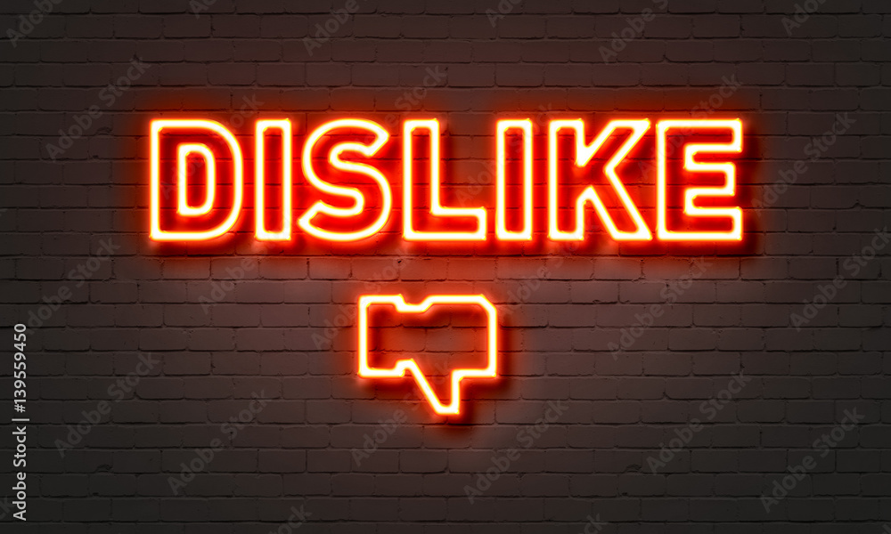 Dislike neon sign on brick wall background. Dislike neon sign on brick wall background.