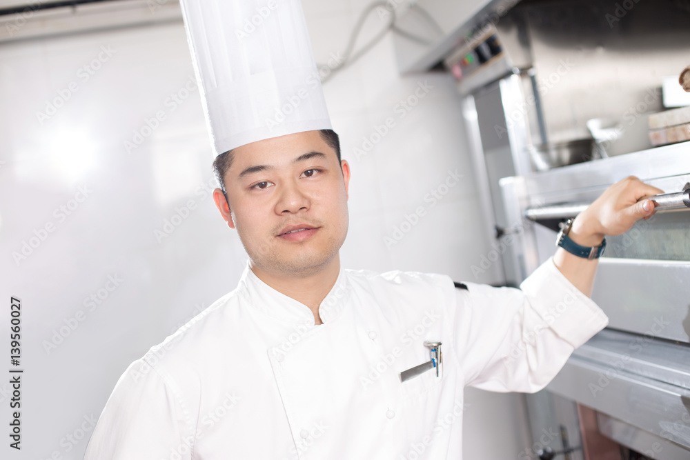 young man chelf in modern kitchen