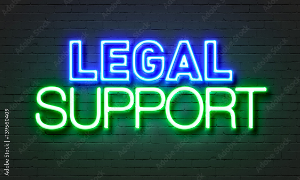 Legal support neon sign on brick wall background.