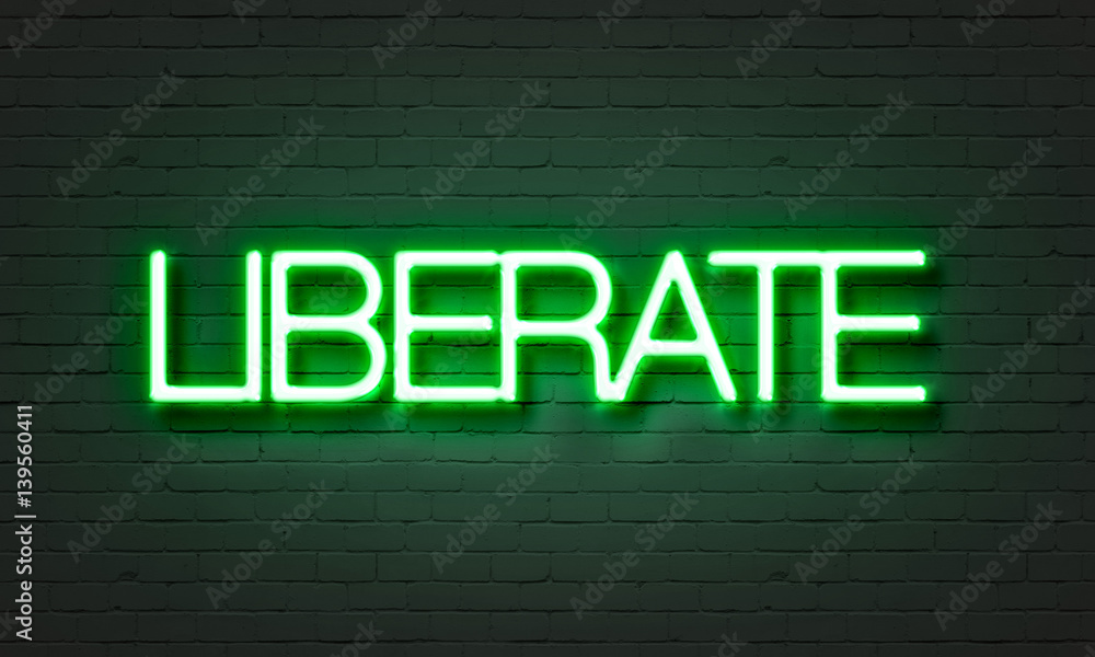 Liberate neon sign on brick wall background.