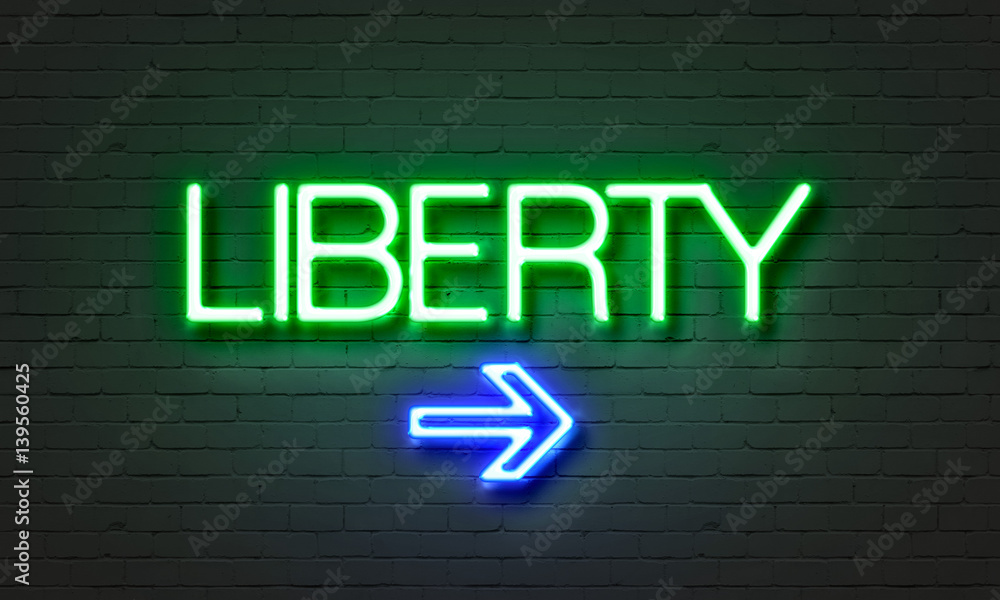 Liberty neon sign on brick wall background. Liberty neon sign on brick wall background.