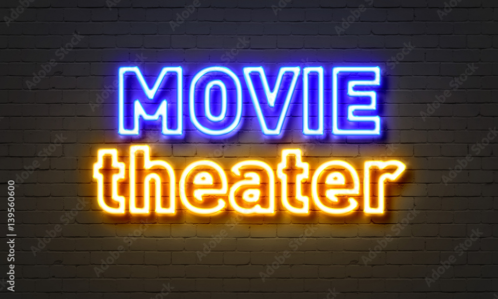 Movie theater neon sign on brick wall background. Movie theater neon sign on brick wall background.