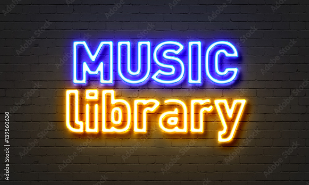 Music library neon sign on brick wall background.