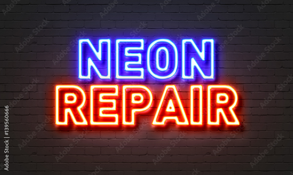 Neon repair neon sign on brick wall background. Neon repair neon sign on brick wall background.