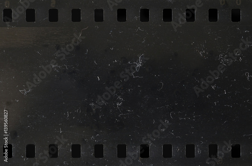 Strip of old celluloid film with dust and scratches photo