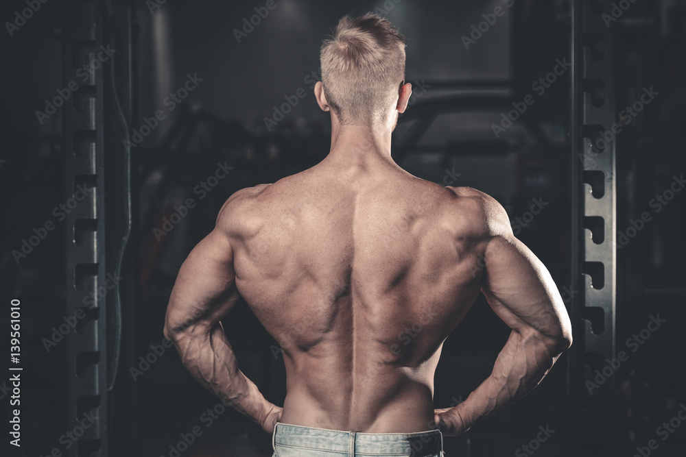 Handsome power athletic man diet training pumping up back muscles Handsome power athletic man diet training pumping up back muscles