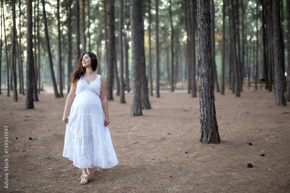 Young happy pregnant woman relaxing and enjoying life in nature Young happy pregnant woman relaxing and enjoying life in nature