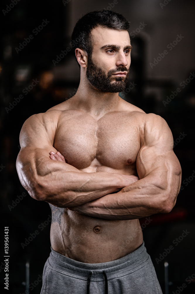 Fototapeta premium Brutal caucasian handsome fitness men on diet training chest pumping