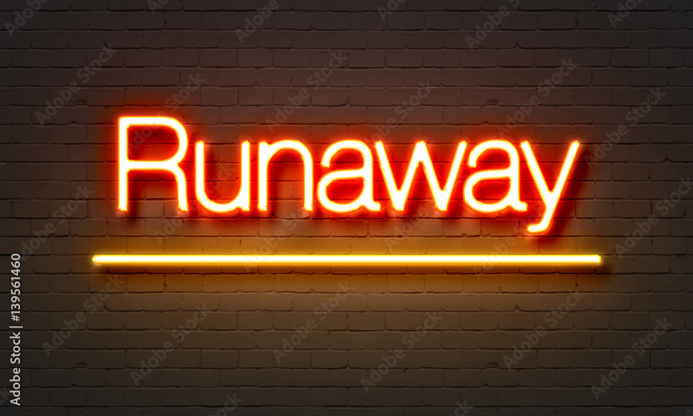 Runaway neon sign on brick wall background.