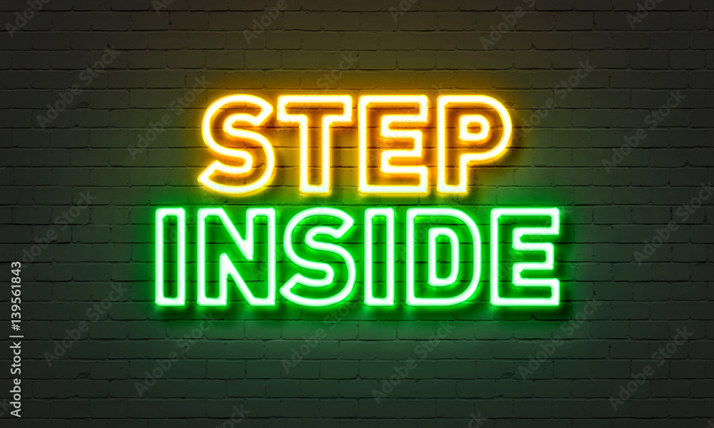 Step inside neon sign on brick wall background. Step inside neon sign on brick wall background.