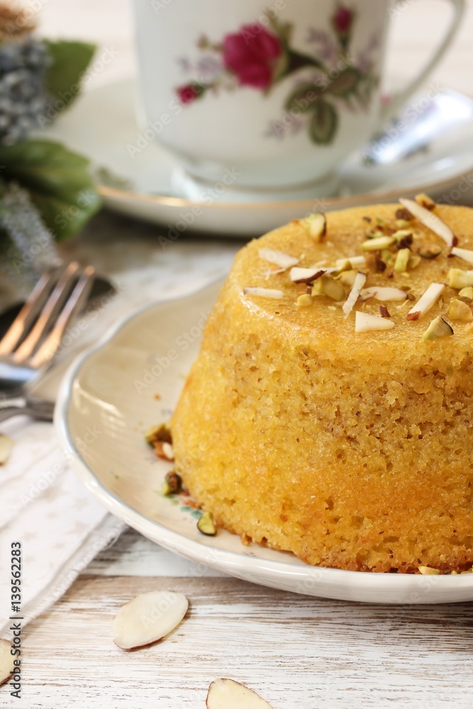Gluten free Almond cornmeal cake topped with nuts, selective focus Gluten free Almond cornmeal cake topped with nuts, selective focus