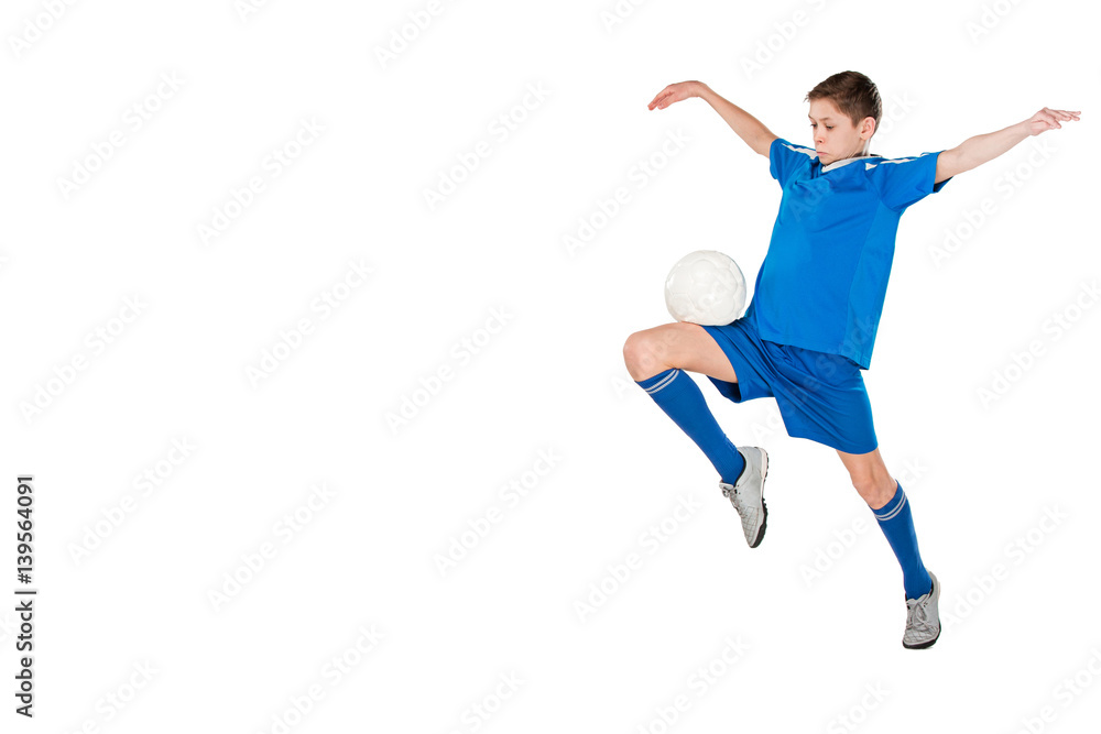 Young boy with soccer ball doing flying kick Young boy with soccer ball doing flying kick