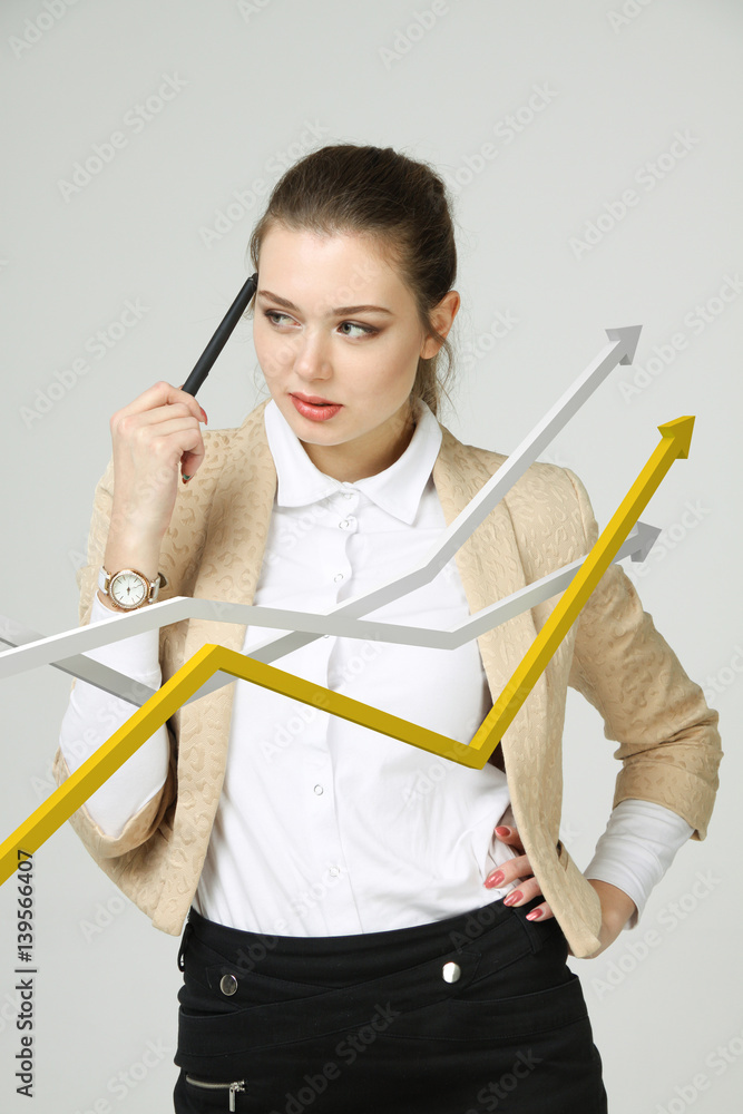 Businesswoman working with growth graph on grey background Businesswoman working with growth graph on grey background