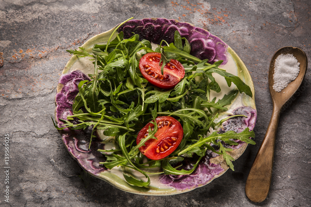 Fresh salad tomatoes and mixed greens (arugula, mesclun, mache Fresh salad tomatoes and mixed greens (arugula, mesclun, mache