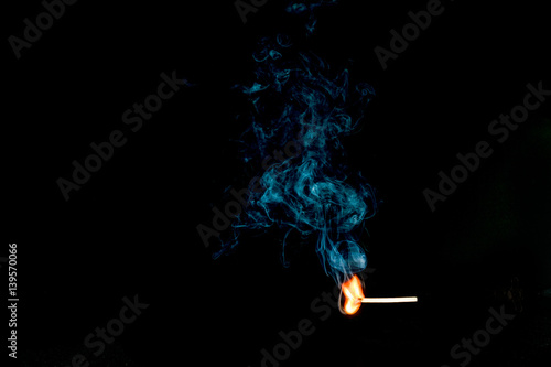 Stiking Match and Billowing Smoke photo
