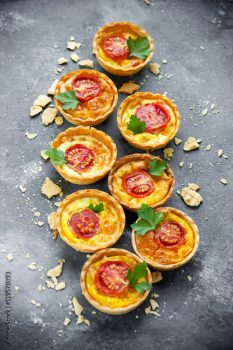 Cheese tomato tartlets , puff pastry appetizers , italian antipasti wine snack