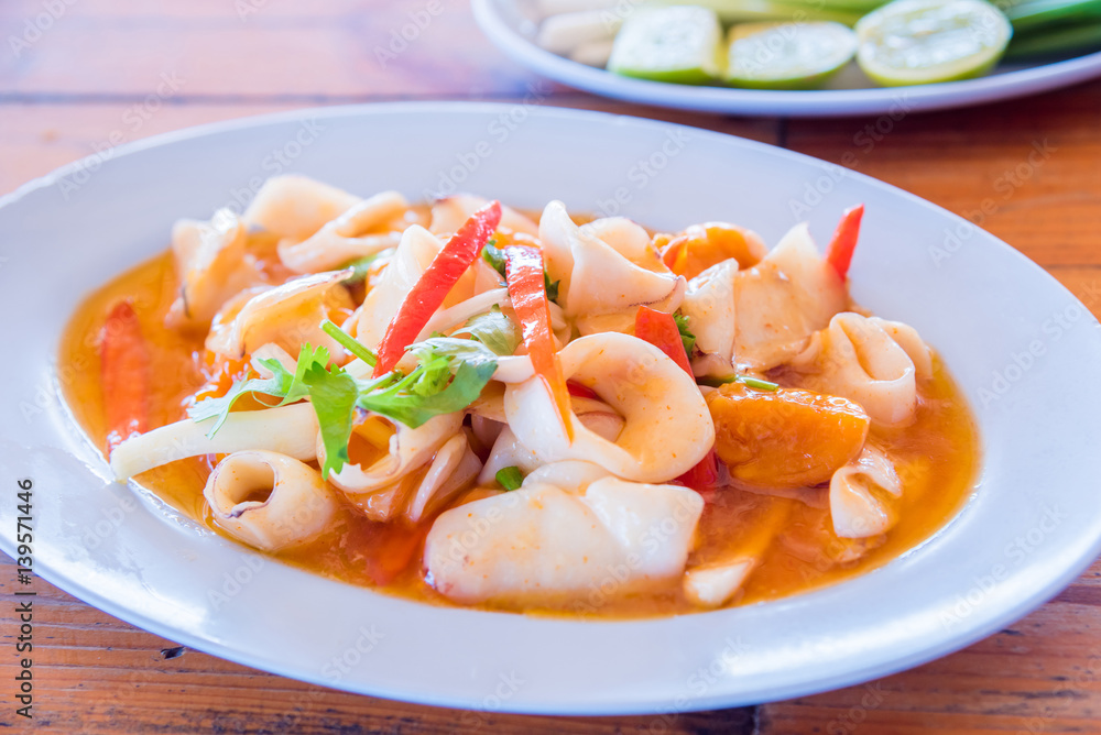 Fried Squid with salted egg sauce on dish Fried Squid with salted egg sauce on dish