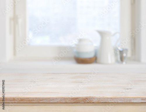 Fototapeta Naklejka Na Ścianę i Meble -  Wooden table top on blurred kitchen window background