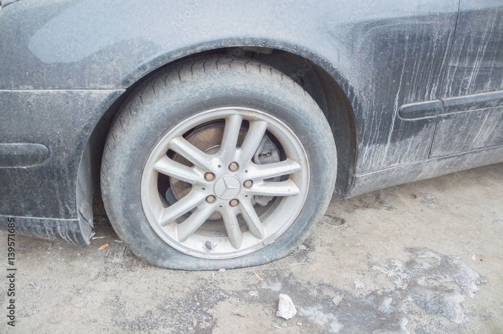 Russia, Saint-Petersburg, February 16, 2017 - dirty Mercedes with a broken wheel. Russia, Saint-Petersburg, February 16, 2017 - dirty Mercedes with a broken wheel.